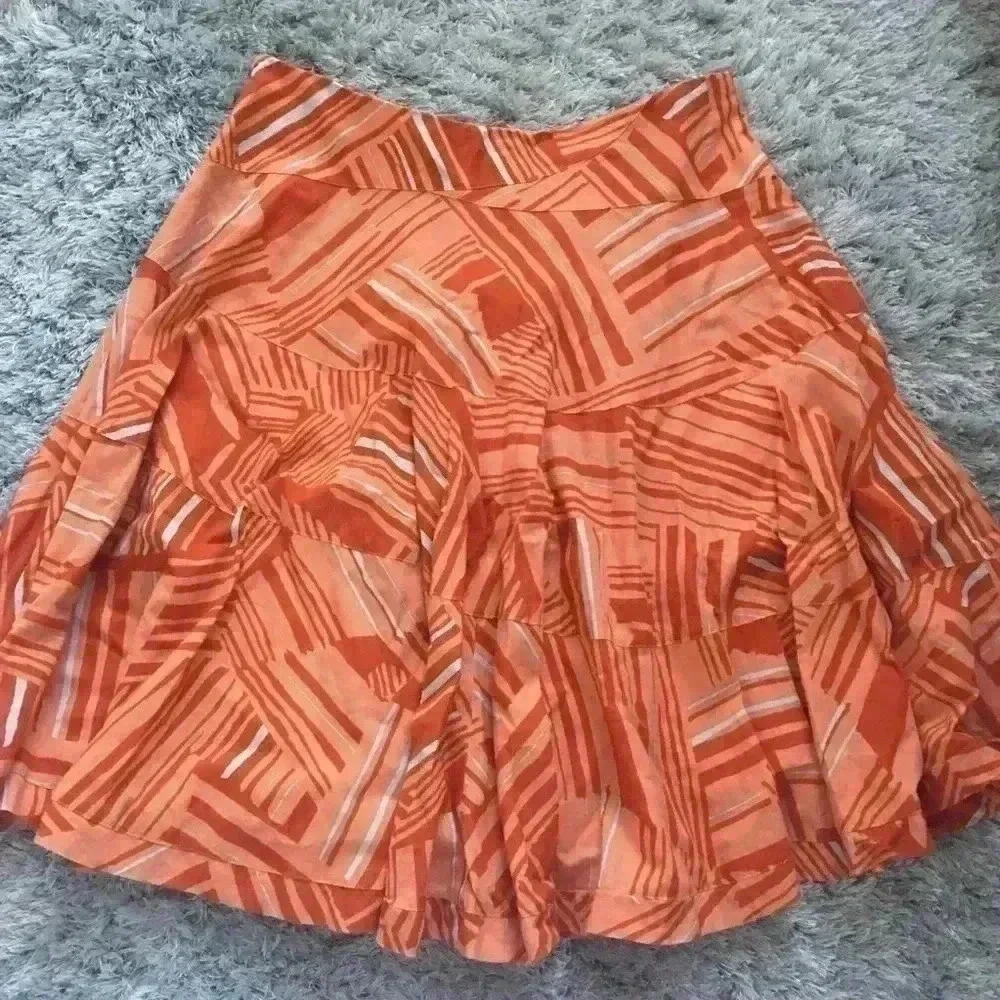 Anthropologie orange patterned midi‎ skirt